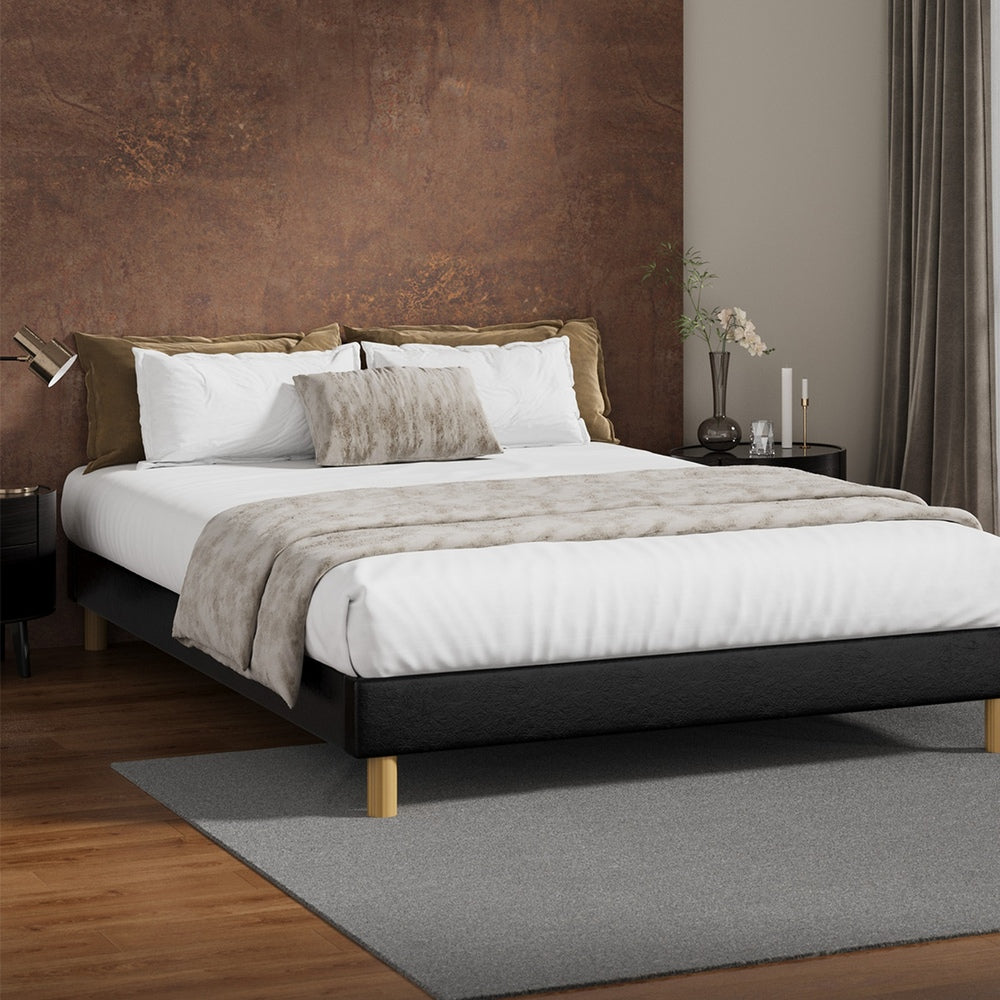 Sleek Queen Bed Base With Black Leather Upholstery And Durable Frame
