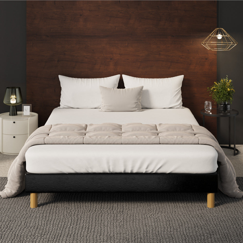 Sleek Queen Bed Base With Black Leather Upholstery And Durable Frame