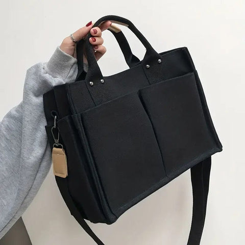 Effortless Travel Companion: Simple Canvas Tote Bag with Wide Strap and Multi Pockets