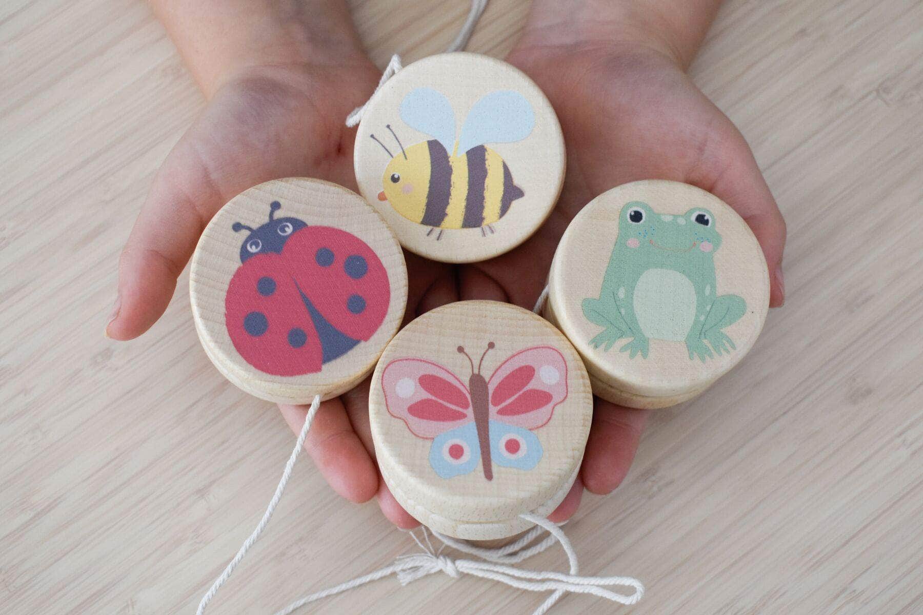 Wooden spring insect yo yo set of 4