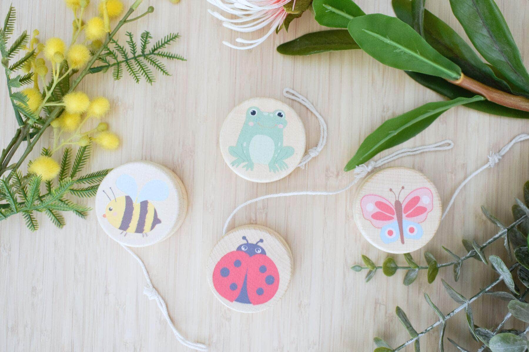 Wooden spring insect yo yo set of 4